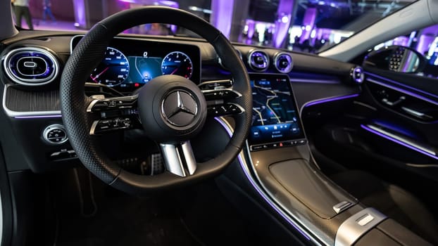 Kyiv, Ukraine - September 12: Mercedes-Benz luxury car interior showcasing the sleek design of the steering wheel, digital dashboard, and advanced navigation system