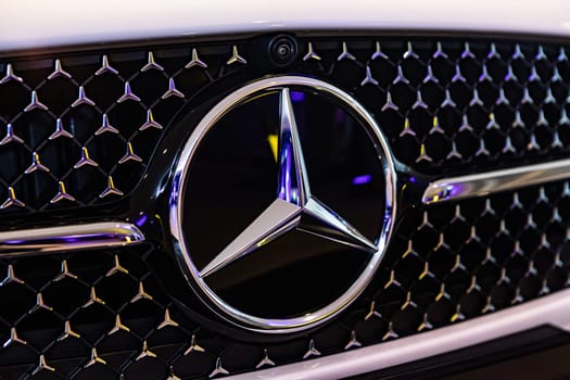 Kyiv, Ukraine - September 12, 2024: Mercedes-Benz logo on a luxury car grille, highlighting the brand's sleek design and premium craftsmanship