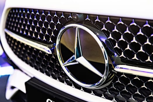 Kyiv, Ukraine - September 12, 2024: Mercedes-Benz logo on a luxury car grille, highlighting the brand's sleek design and premium craftsmanship