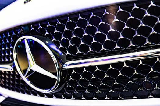 Kyiv, Ukraine - September 12, 2024: Mercedes-Benz logo on a luxury car grille, highlighting the brand's sleek design and premium craftsmanship