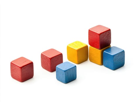 Vibrant wooden cubes arranged in various sizes on white background.