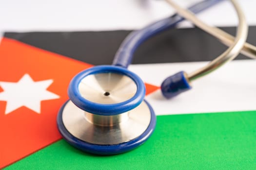 Stethoscope on Jordan flag background, Business and finance concept.