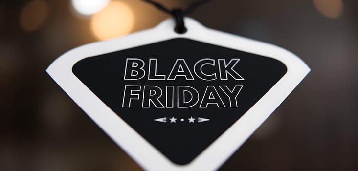 A hangtag for Black Friday features bold text against a dark background, creating excitement for the upcoming shopping event with its promotional sentiments.
