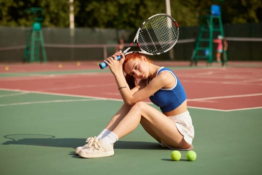 young athletic girl tennis player plays tennis on the court, active recreation, tennis training,