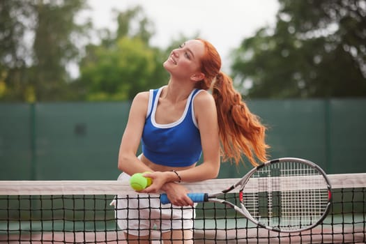 young woman playing tennis on the tennis court, olympic sport, outdoor activity concept