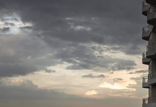 Balconies of high residential building with cloud and before sunset sky. Relaxing feeling and inspirational, Nature abstract composition, Space for text, Selective focus.
