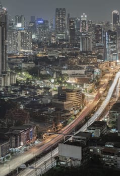 Bangkok, Thailand - 16 Sep, 2024 - City night view of Bangkok city skyscrapers after sunset. Bangkok downtown cityscape in Business district with bright glowing lights at night, Space for text, Selective focus.