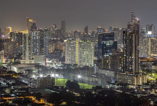 Bangkok, Thailand - 16 Sep, 2024 - Bangkok downtown cityscape in Business district with bright glowing lights at night. City night view of Bangkok city skyscrapers after sunset, Space for text, Selective focus.