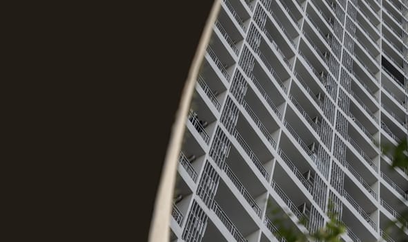 Bangkok, Thailand - 31 Aug, 2024 - Looking up geometric shapes on residential building in Bangkok. An awesome abstract pattern of repetitive details, Space for text, Selective focus.
