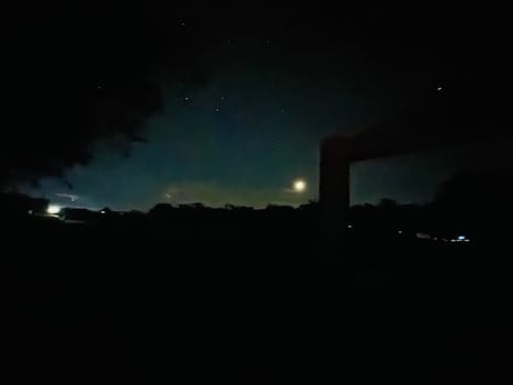 a night sky with trees and stars. High quality photo