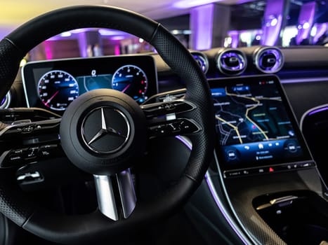 Kyiv, Ukraine - September 12: Mercedes-Benz luxury car interior showcasing the sleek design of the steering wheel, digital dashboard, and advanced navigation system