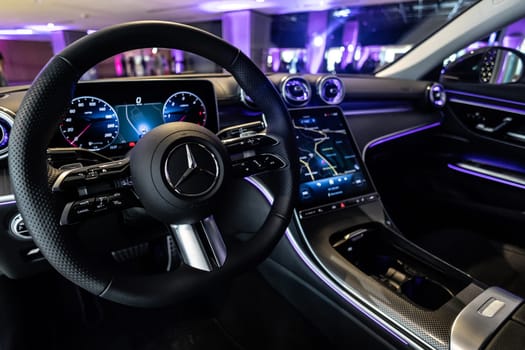 Kyiv, Ukraine - September 12: Mercedes-Benz luxury car interior showcasing the sleek design of the steering wheel, digital dashboard, and advanced navigation system