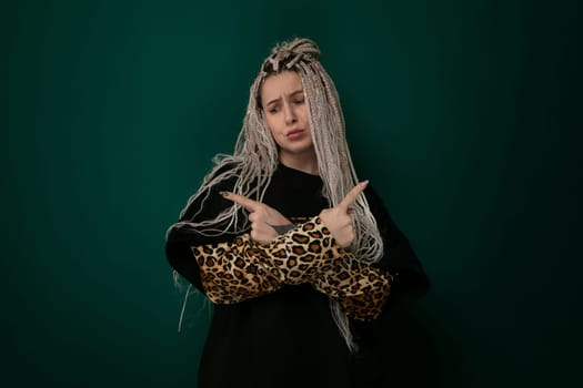 A woman with long flowing hair stands confidently holding a stylish leopard print purse. Her hair cascades down her shoulders as she showcases the trendy accessory.