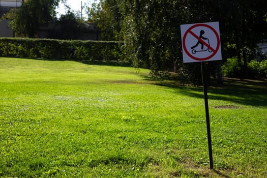Special sign for rules in public park prohibiting riding electric scooters. Traffic regulation on the streets of a modern city. No allow scooter