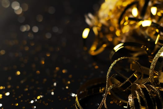 Confetti and ribbons create a festive celebration with sparkle, glitter, and gold bokeh for a shiny party