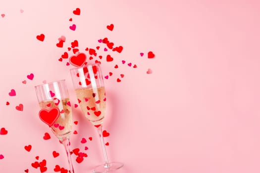 Romantic celebration with champagne glasses, hearts, and sparkling pink bubbles for Valentines holiday