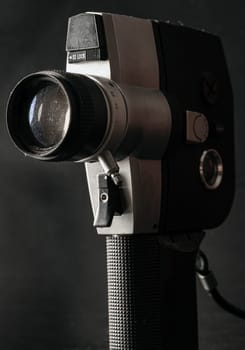 Bangkok, Thailand - 17 Sep, 2024 - Close-up of Old movie camera 8mm with dark background. Light and Shadow, Space for text, Selective focus.