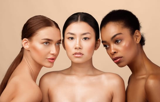 Three Naked Women Models Standing Shirtless Posing In Studio On Gray Background. Natural Female Beauty
