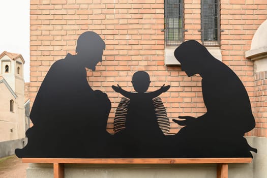 Christmas carved figurines in a creche with Joseph Mary and small Jesus