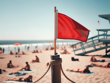 a small red flag at the beach lifeguard post prohibiting swimming.