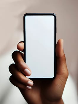 a smartphone with a white screen in the hand of a Black woman, close-up