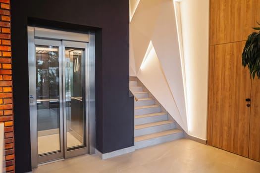 The spacefeatures elegant doors that add charm and style to the space. The design and craftsmanship of the doors stand out in the well-appointed space, creating a visually striking focal point.