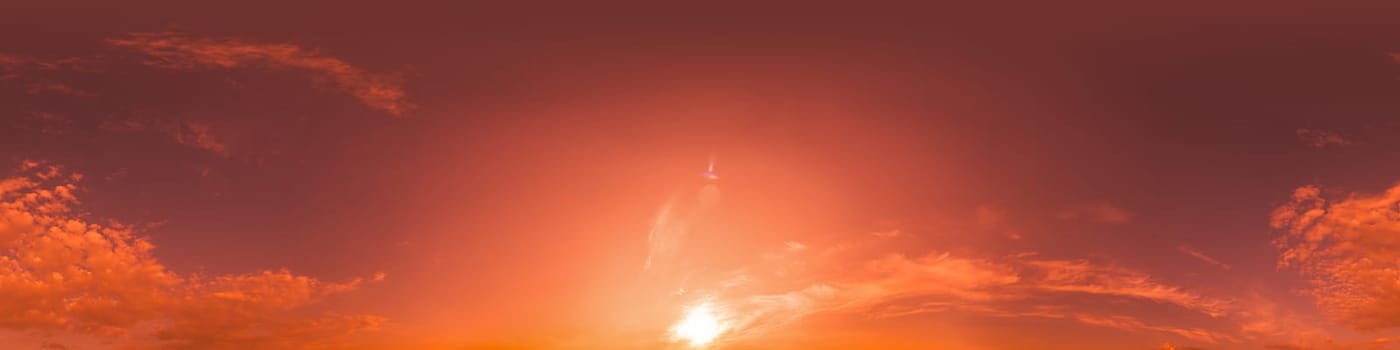 Dramatic Sunset sky 360 panorama. Vibrant sky with bright glowing red pink Cumulus clouds. HDR 360 seamless spherical panorama. Sky dome for aerial drone panoramas. Climate and weather change