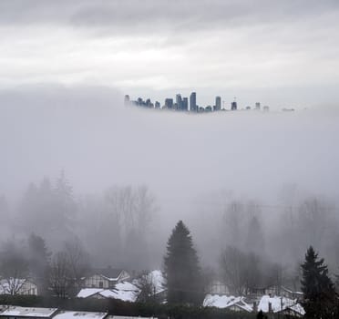 City in the sky. Foggy winter morning in Vancouver, Canada.