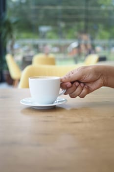 women holding a coffee cup .