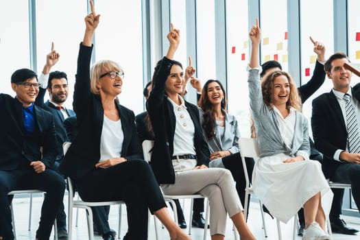 Group of business people meeting in a seminar conference . Audience listening to instructor in employee education training session . Office worker community summit forum with expert speaker . Jivy