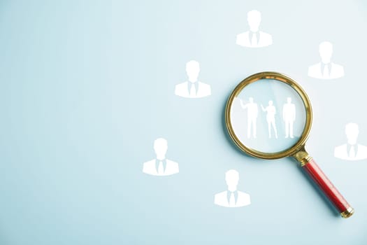Close-up of a magnifying glass highlighting job search, symbolizing the power of research and discovery in finding employment. Navigating the competitive job market. job search