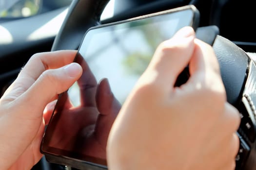 business man Sitting in the Car and Using digital tablet.