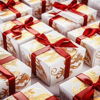 A white gift box with a dragon image is tied with a red ribbon. High quality photo