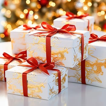A white gift box with a dragon image is tied with a red ribbon. High quality photo