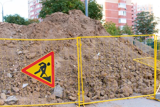 dig hole trench ground heap sewage drainage pipe construction underground sign work water