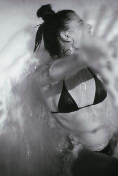 This is a striking black and white image that beautifully captures both movement and deep emotion in water