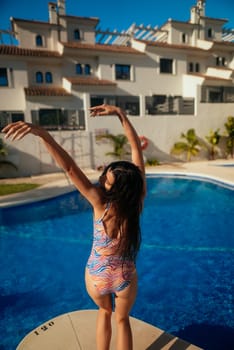A joyful person enjoys the warm sun by the shimmering pool in colorful swimwear, radiating carefree vibes