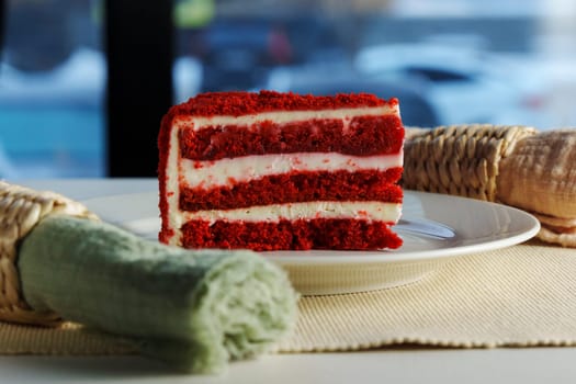 Savoring a delicious slice of red velvet cake in a cozy caf setting on a winter afternoon