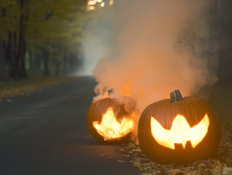Two carved pumpkins illuminating a mysterious, smoke filled country road at twilight