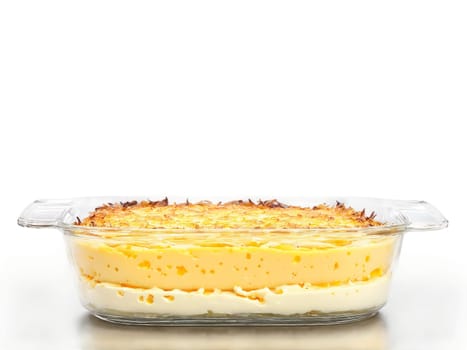 Winter comfort potato gratin with layers of cheese and cream served in a transparent glass. Food isolated on transparent background.