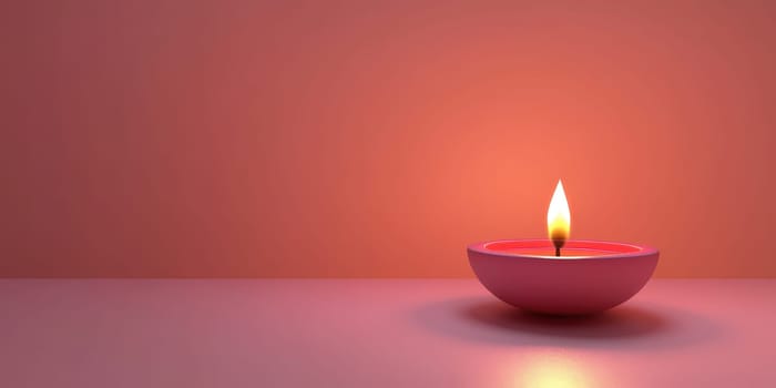 Single lit pink Diya lamp on pink background for Diwali festival celebration