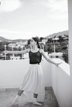 An elegant dancer displays the art of movement and deep expression against a stunning scenic backdrop