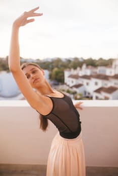 A graceful ballet dancer strikes a stunning and captivating pose on a rooftop, beautifully embodying elegance and poise