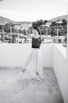 A graceful and talented dancer beautifully showcases her exquisite art against a stunning and picturesque backdrop