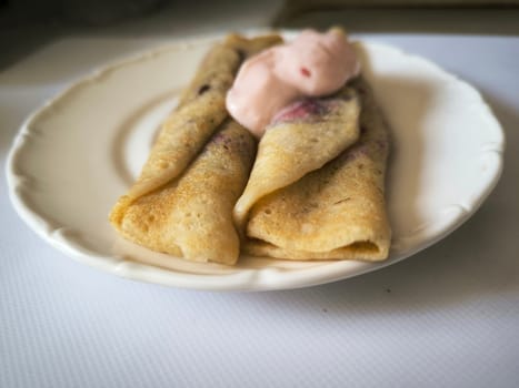 pancakes with cottage cheese and yogurt on a white plate, food. High quality photo