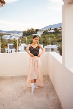 A dancer elegantly poses on a sunlit balcony, impeccably showcasing her grace, beauty, and stylish flair