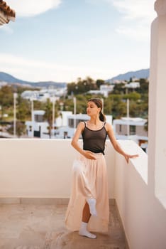 A serene moment of a model in a flowing skirt on a balcony, surrounded by nature, creating a picturesque scene