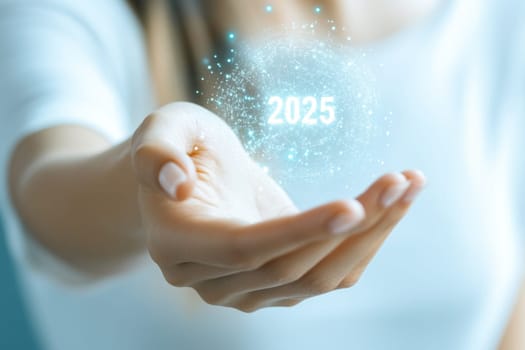Businesswoman holding a futuristic sphere in her hand, with the year 2025 glowing inside, symbolizing future opportunities and technological advancements