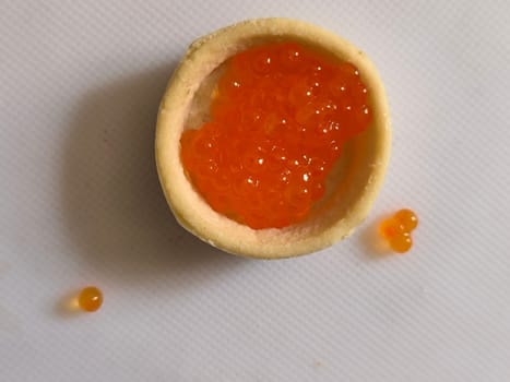 red caviar, healthy food, snack, white background texture. High quality photo