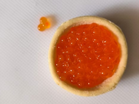 red caviar, healthy food, snack, white background texture. High quality photo